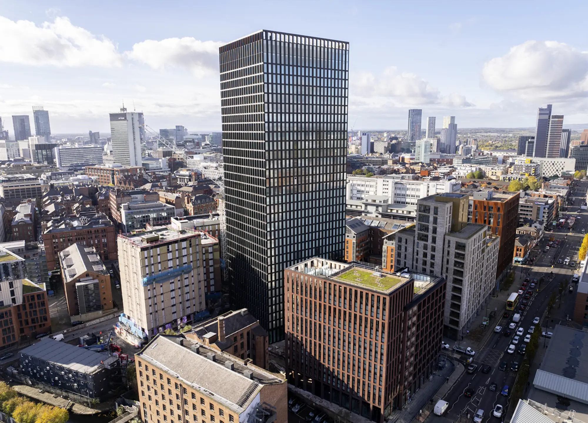 One Port Street, a dark-clad office building in Manchester city centre, seen from the air